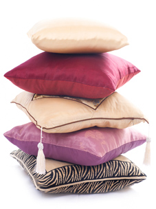 Stack of colourful cushions filled with Recron® Fibrefill