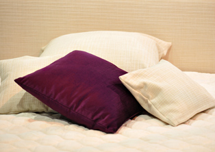 Pillows on a bed filled with Recron® Fibrefill